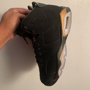 Grade School Jordan’s black and gold. Good condition